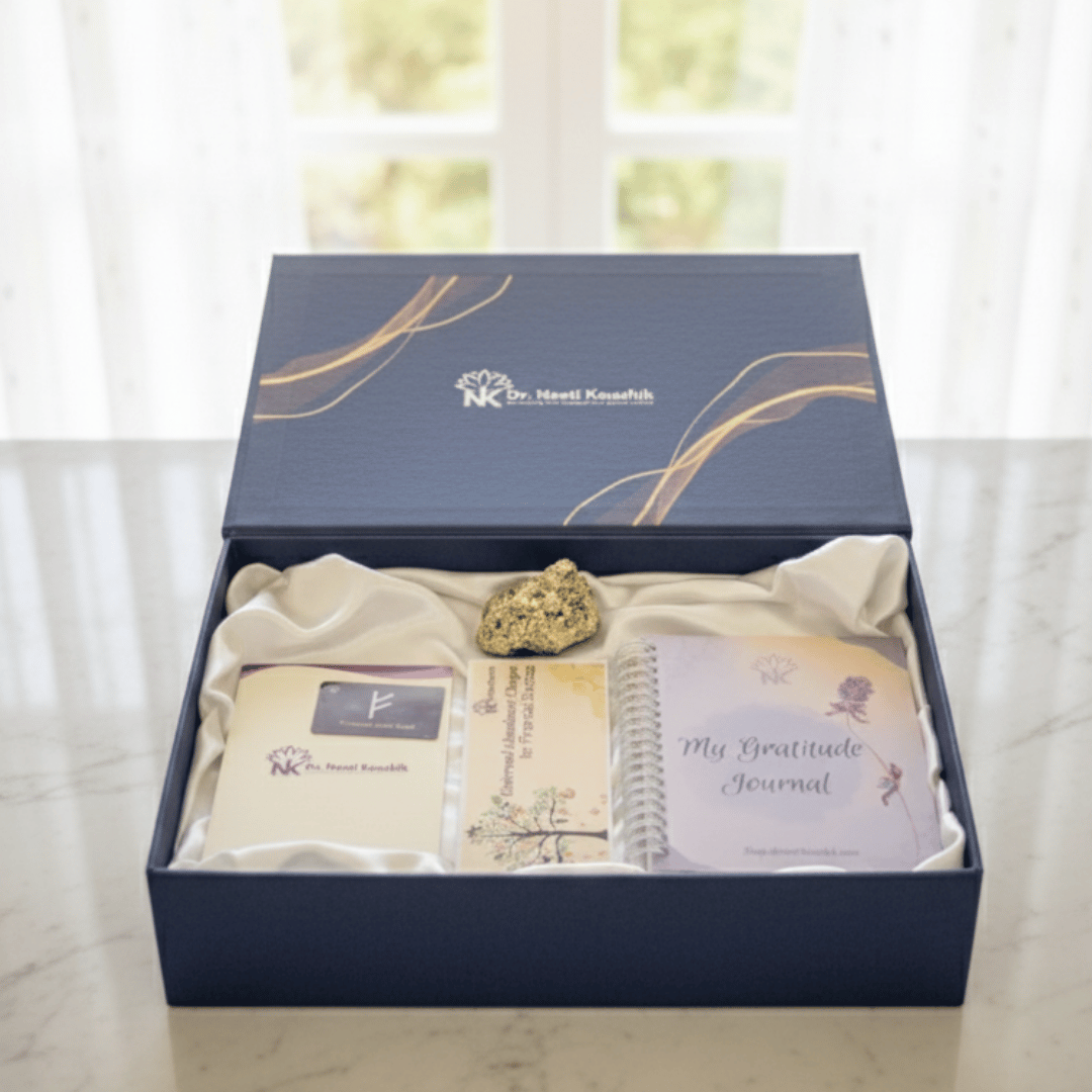 Gift set with a gratitude journal, card, and rock in a decorative box on a light background