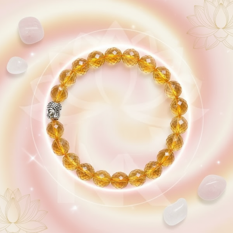 Yellow beaded bracelet with a silver clasp on a soft pink background