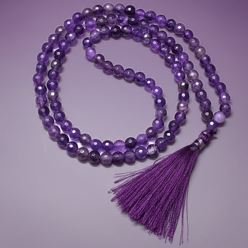 ametrine necklace with a tassel on a purple background