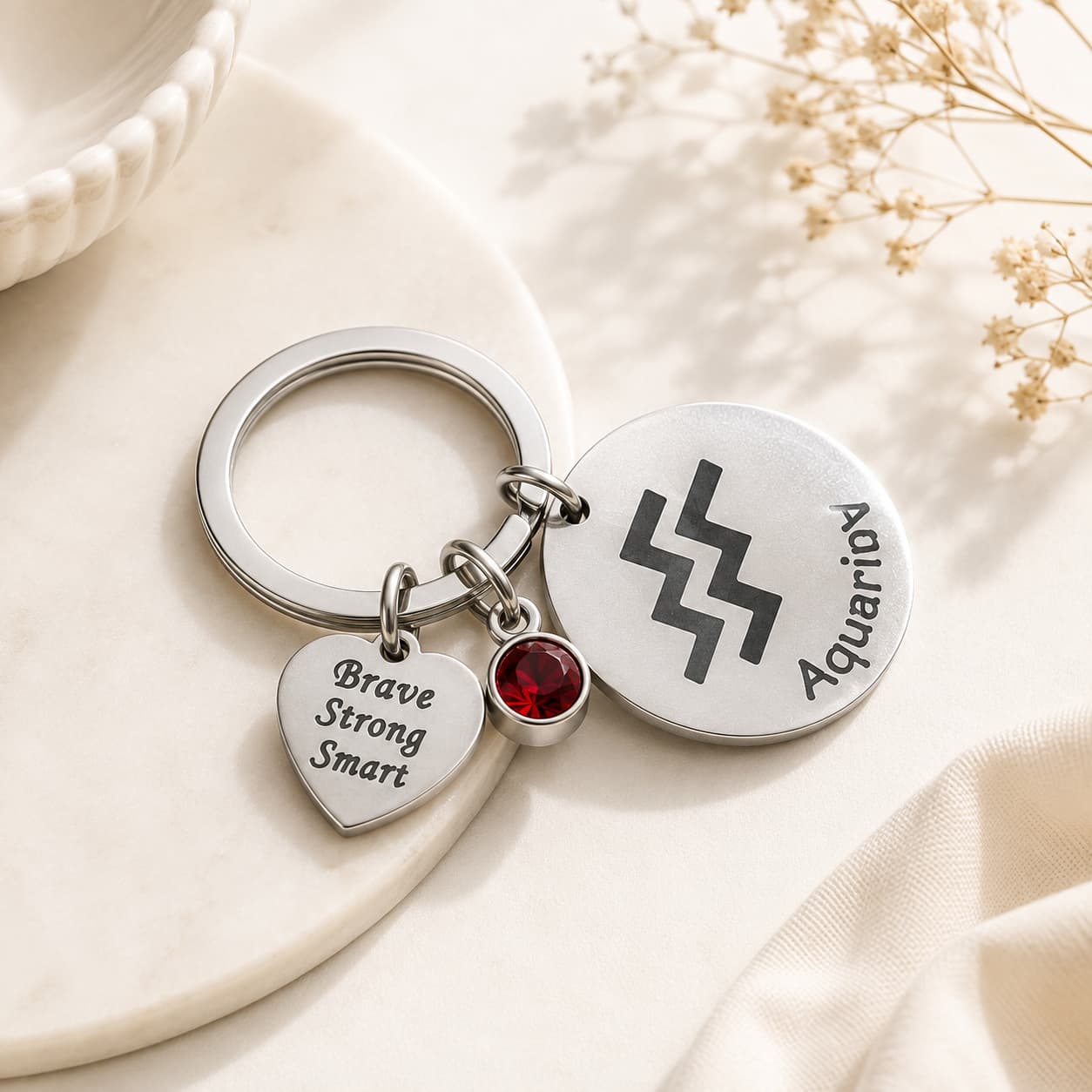 The Aquarius Keychain Zodiac - Luck Charm with Blood Red Corundum