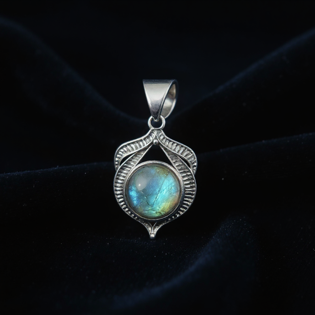 Silver pendant with a labradorite stone on a dark background
