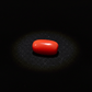 Red coral gemstone on a black background